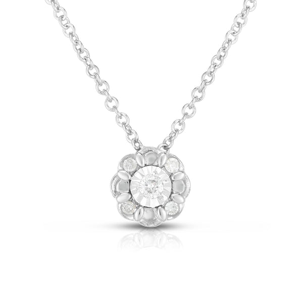 photo of delicate necklace, .10twt round diamonds set in sterling silver with diamond cutting and scalloped details for the extra radiance.