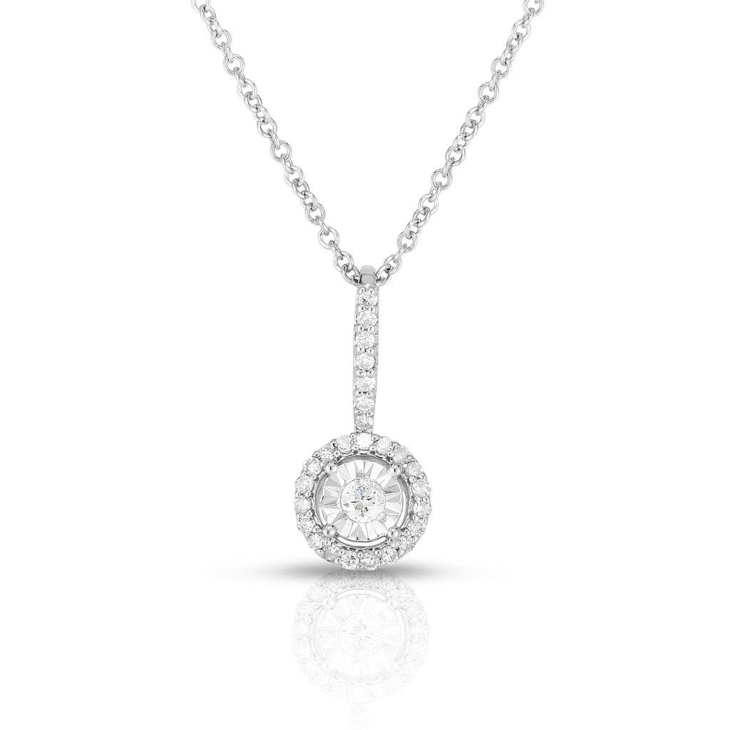 photo of classic solitaire diamond pendant with diamond cut details for added sparkle, .15twt round diamonds set in sterling silver and worn on an 18" cable chain
