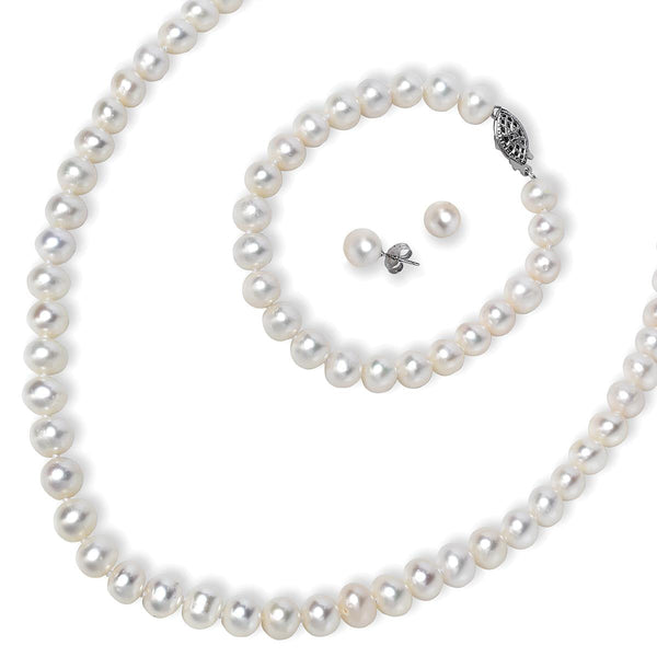 photo of white pearl set, includes earrings, 7" bracelet and an 18" strand